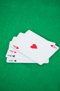 Poker aces on a playmats