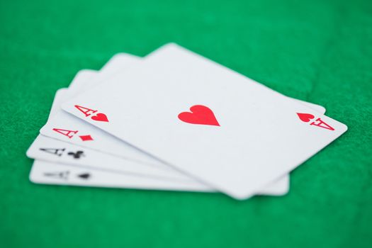 Poker cards on a green playmats