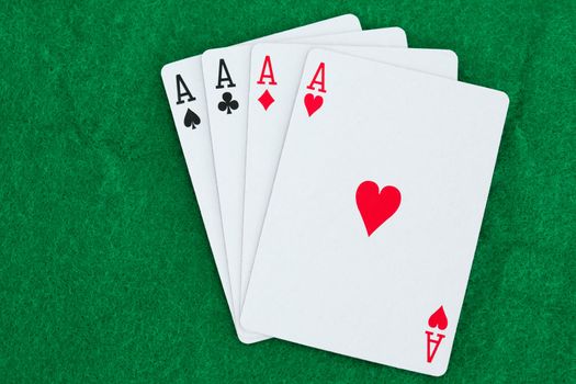 Playing cards on a poker mats