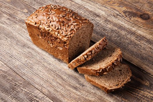 Brown bread on an old wooden table