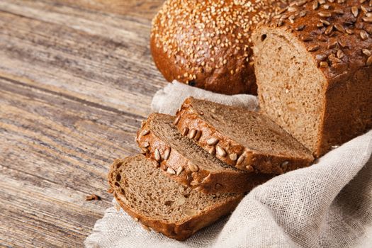 Brown bread on an old wooden table