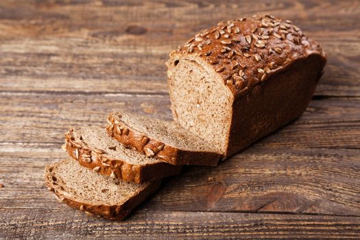 Brown bread on an old wooden table