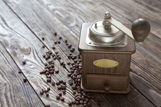 Vintage coffee grinder on a wooden table