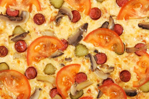 Closeup picture of pizza with tomatoes and pepperoni