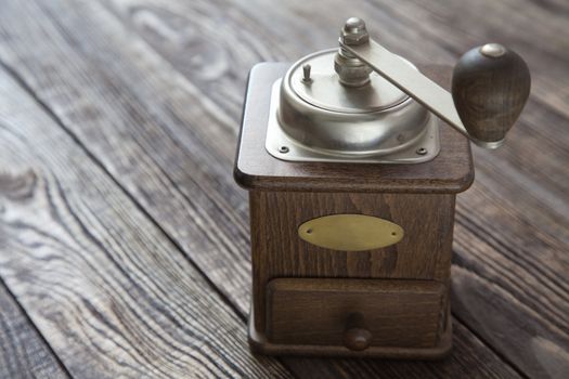 Vintage coffee grinder on a wooden table