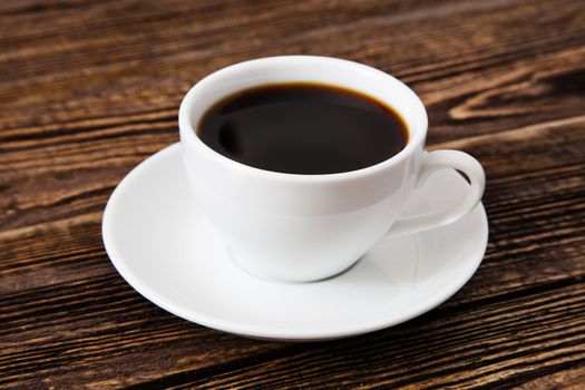 Cup of coffee on a wooden table