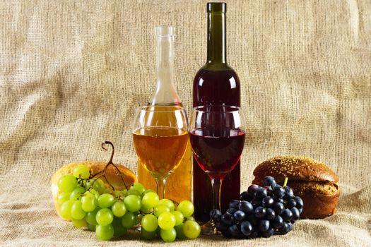 Wine and grapes on vintage background, studio photo