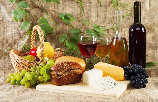 Wine and grapes on vintage background, studio photo