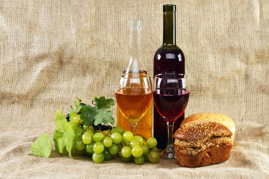 Wine and grapes on vintage background, studio photo