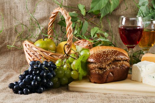 Wine and grapes on vintage background, studio photo