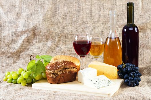 Wine and grapes on vintage background, studio photo