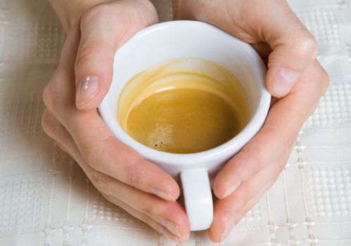 Coffee cup in female hands