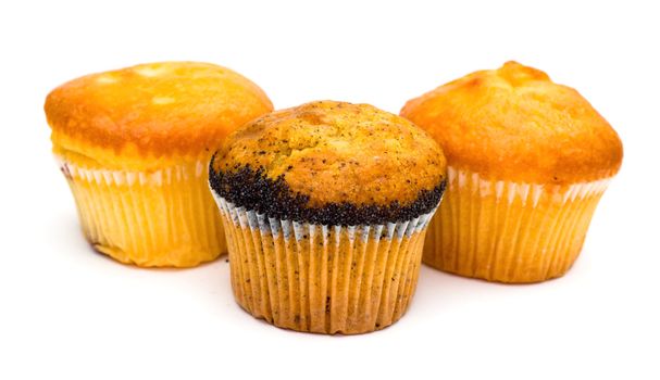 Three tasty muffins with poppies isolated on white background