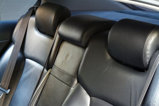 Leather back car seats with active headrest