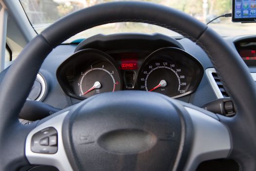 Interior of a modern car, steering wheel and dashboard