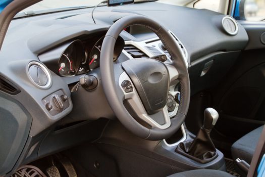 Interior of a modern car, steering wheel and dashboard