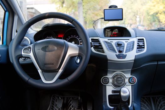 Interior of a modern car, steering wheel and dashboard