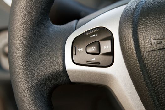 Audio control knob on a steering wheel