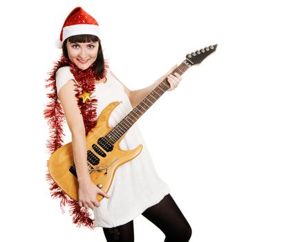 Joyful christmas girl with an electric guitar