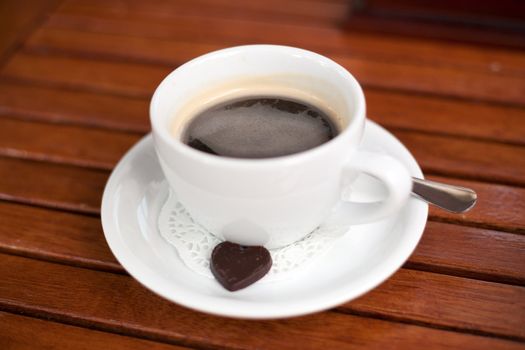 Coffee cup with a chocolate candy