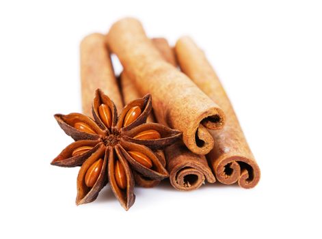 Cinnamon sticks and anisetree isolated on white background