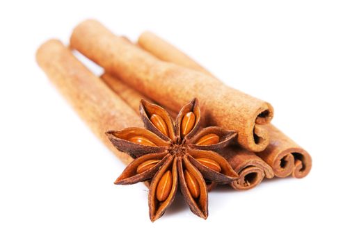 Cinnamon sticks and anisetree isolated on white background