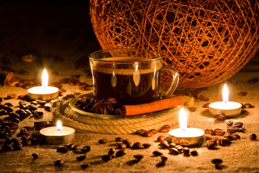 Cup of coffee in natural candle lighting