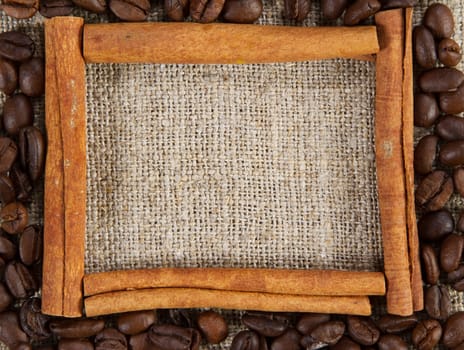 Cinnamon sticks frame on a sacking cloth