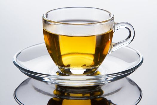 Tea cup with fresh mint leaves, closeup photo