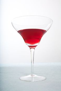 detail of cocktail glass with red beverage