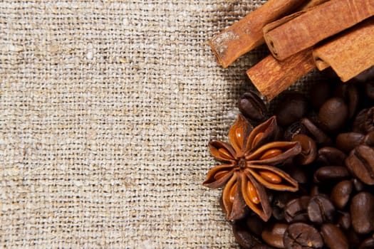 Coffee and spice on a rough cloth closeup photo