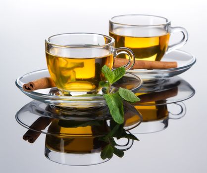 Tea cup with fresh mint leaves, closeup photo