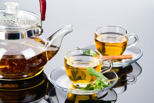 Tea cup with fresh mint leaves, closeup photo