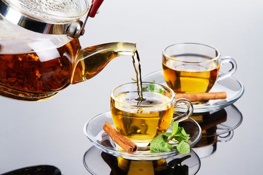 Tea cup with fresh mint leaves, closeup photo