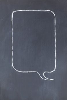 Empty rectangular speech bubble on a blackboard