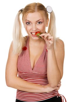 Beautiful girl tasting a strawberry, face portrait