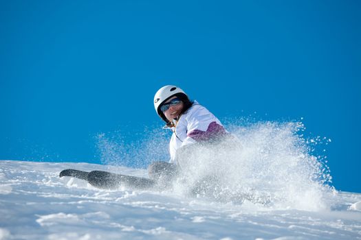 Female skier coming down the slope