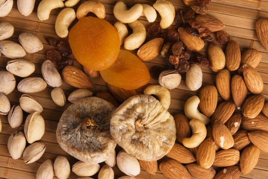 Nuts, fig and dried apricots still life