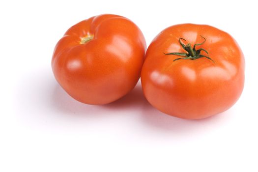 Ripe tomatoes on white background