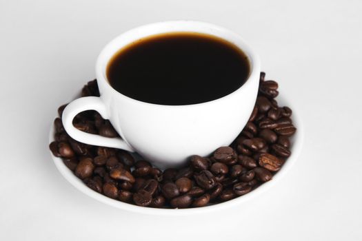 Cup of strong coffee, neutral background