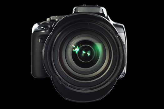 Professional digital camera on black background