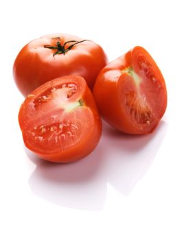 Ripe tomatoes on white background