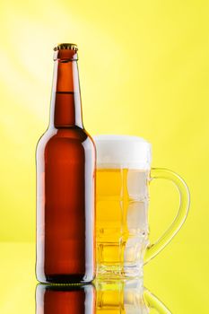 Beer mug and bottle isolated on white background, studio photo