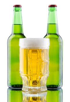 Beer mug and bottle isolated on white background, studio photo