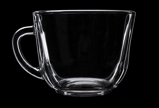 Glass tea cup isolated on black background