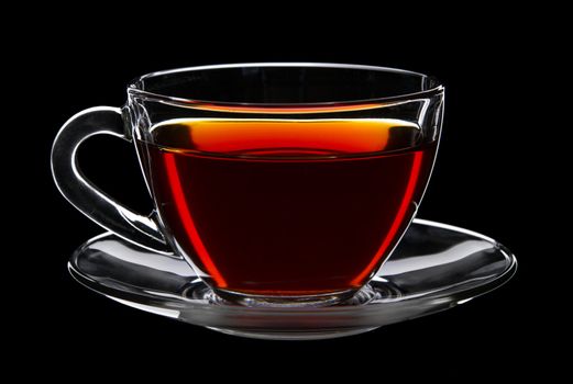 Cup of black tea isolated on black background