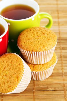 Cups of tea with cakes 