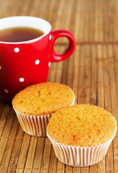 Cup of tea with muffins