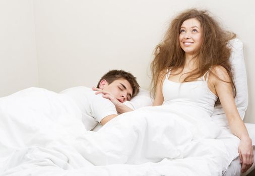 Young couple resting in bed