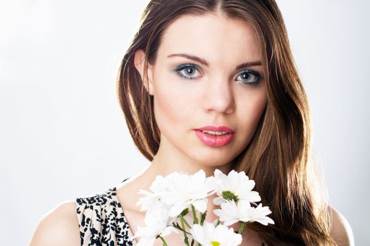 Face portrait of a beautiful woman, neutral background